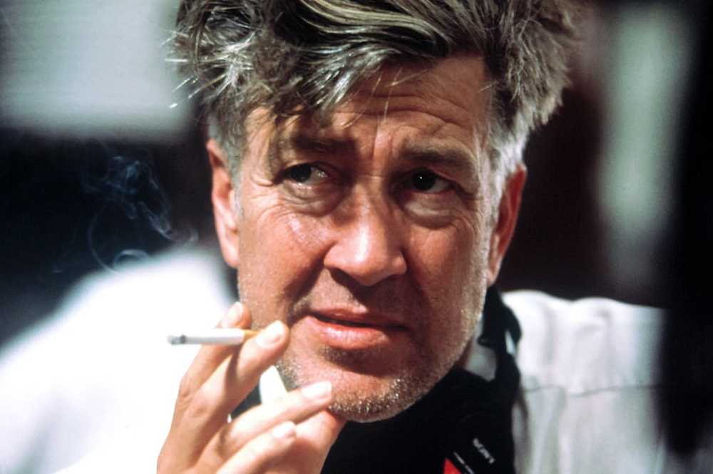 Candid shot of David Lynch, cigarette in hand